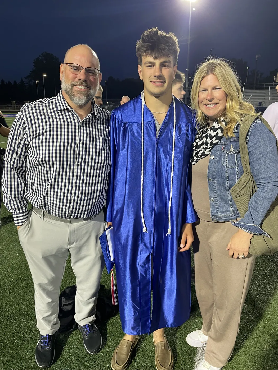 Harrison Drvenkar, owner of Grass 'n' Gardens, at his graduation with his parents